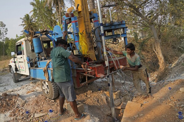 Laborers work to drill a borewell for groundwater in Bengaluru, India, Monday, March 11, 2024. Groundwater, relied on by over a third of the city's 13 million-strong population, is fast running out. (AP Photo/Aijaz Rahi)