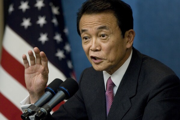FILE - Then Prime Minister Taro Aso of Japan speaks with reporters during a news conference at the end of the financial summit in Washington, Nov. 15, 2008. Former President Donald Trump is meeting with another foreign leader while he’s in New York for his criminal hush money trial. The presumptive GOP nominee will host former Japanese prime minister Taro Aso at Trump Tower Tuesday, according to two people familiar with the plans. (AP Photo/J. Scott Applewhite, File)