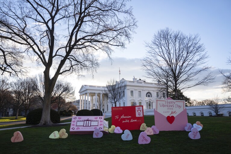 Decorations for Valentine's Day adorn the White House lawn, Wednesday, Feb. 14, 2024, in Washington. (AP Photo/Evan Vucci)