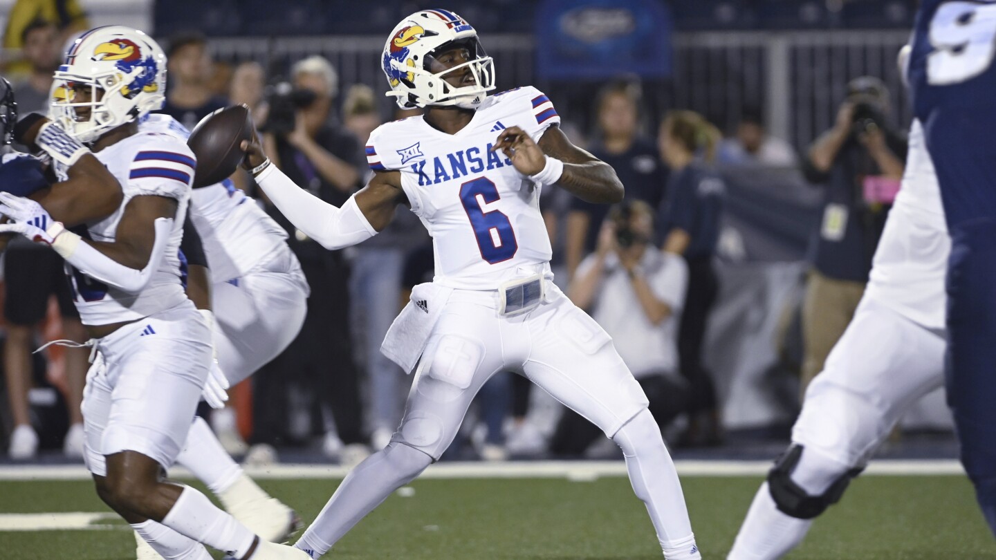 Neal runs for 3 TDs, Hinshaw Jr. adds runs for another to help Kansas beat Nevada 31-24