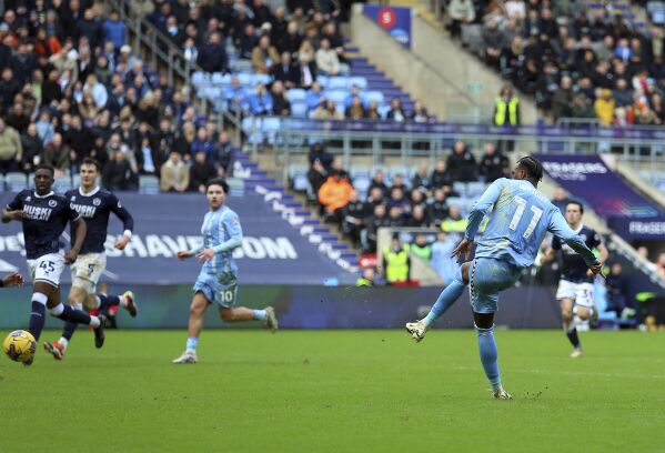 Coventry City's Haji Wright scores their side's second goal of the game during the English League Championship match at the Coventry Building Society Arena, in Coventry, England, Sunday Feb. 11, 2024. Wright, who plays for Coventry City in England鈥檚 second-tier Championship, took part in an impromptu on-field game of rock, paper, scissors with teammate Callum O鈥橦are to determine who took a penalty in the team鈥檚 match against Millwall. Wright won it and converted the spot kick by sending the goalkeeper the wrong way, setting Coventry on course for a 2-1 victory on Sunday. (Nigel French/PA via 番茄直播)