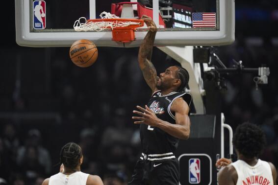 Los Angeles Clippers' Kawhi Leonard (2) makes a dunk during first half of an NBA basketball game against the Toronto Raptors Wednesday, March 8, 2023, in Los Angeles. (AP Photo/Jae C. Hong)