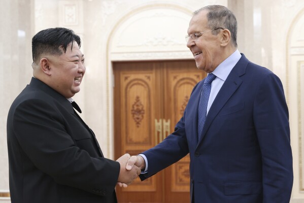 In this photo released by Russian Foreign Ministry Press Service via their telegram channel, Korean leader Kim Jong Un, left, and Russian Foreign Minister Sergey Lavrov greet each other during a meeting in Pyongyang, North Korea, on Thursday, Oct. 19, 2023. (Russian Foreign Ministry Press Service telegram channel via AP)