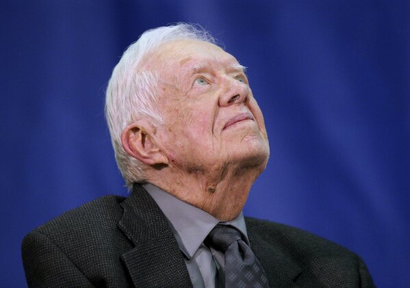 
              Former President Jimmy Carter, 93, gazes heavenward before taking the podium for his annual town hall with Emory University freshman in the campus gym on Wednesday, Sept. 12, 2018, in Atlanta. (Curtis Compton/Atlanta Journal-Constitution via AP)
            