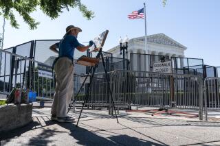 Artist Elaine Wilson works on a painting of the Supreme Court, Wednesday, June 29, 2022, in Washington. (AP Photo/Jacquelyn Martin)