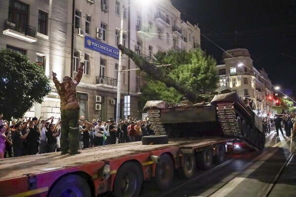 FILE - Members of the Wagner Group military company load their tank onto a truck on a street in Rostov-on-Don, Russia, Saturday, June 24, 2023, prior to leaving an area at the headquarters of the Southern Military District. (AP Photo, File)