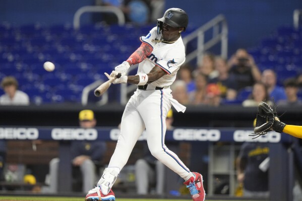 Miami Marlins' Jazz Chisholm Jr. hits solo home run against the Milwaukee Brewers during the first inning of a baseball game Wednesday, May 22, 2024, in Miami. (AP Photo/Lynne Sladky)