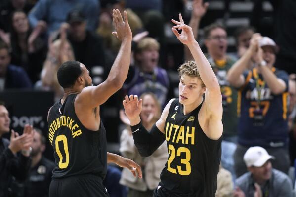 Utah Jazz's Lauri Markkanen (23) celebrates with Talen Horton-Tucker (0) after scoring against the Los Angeles Lakers during the second half of an NBA basketball game Monday, Nov. 7, 2022, in Salt Lake City. (AP Photo/Rick Bowmer)