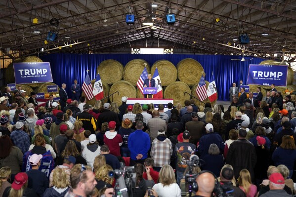 Trump's Iowa campaign rally has stage adorned with mug shot-themed