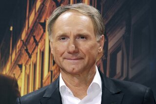 FILE - In this Oct. 10, 2016 file photo, author Dan Brown arrives for the premiere of the movie "Inferno" in Berlin. Blythe Brown, the author's ex-wife, filed a lawsuit Monday, June 29, 2020, in New Hampshire alleging he led a secret life during their marriage that included several affairs. The pair divorced in 2019 after 21 years of marriage. (AP Photo/Markus Schreiber, File)
