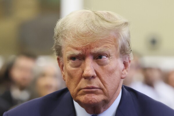 Former President Donald Trump sits in the courtroom at New York Supreme Court, Monday, Oct. 2, 2023, in New York. Trump is making a rare, voluntary trip to court in New York for the start of a civil trial in a lawsuit that already has resulted in a judge ruling that he committed fraud in his business dealings. (Brendan McDermid/Pool Photo via AP)