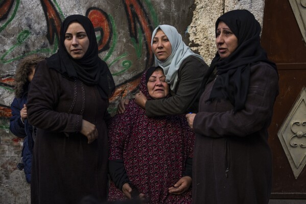 Palestinian women react after their home was hit by an Israeli strike in Rafah, southern Gaza Strip, Thursday, Feb. 8, 2024. (AP Photo/Fatima Shbair)