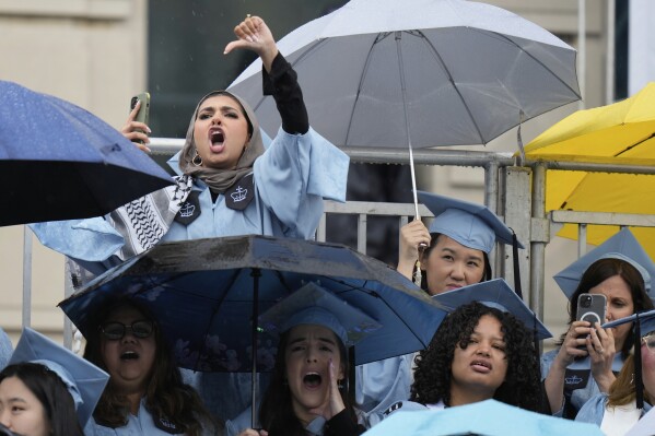 Students will respond to speaking on behalf of Columbia University, speaking on Wednesday, May 21, 2025, at Columbia University's opening ceremony at Columbia University's main campus in Manhattan, New York. (AP Photo/Seth Wenig, pool)