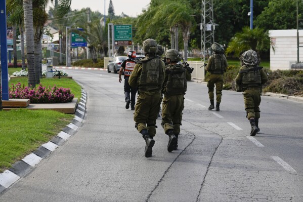 Israeli soldiers deploy in Sderot, Israel, on Saturday, Oct. 7, 2023. AP Photo/Ohad Zwigenberg)