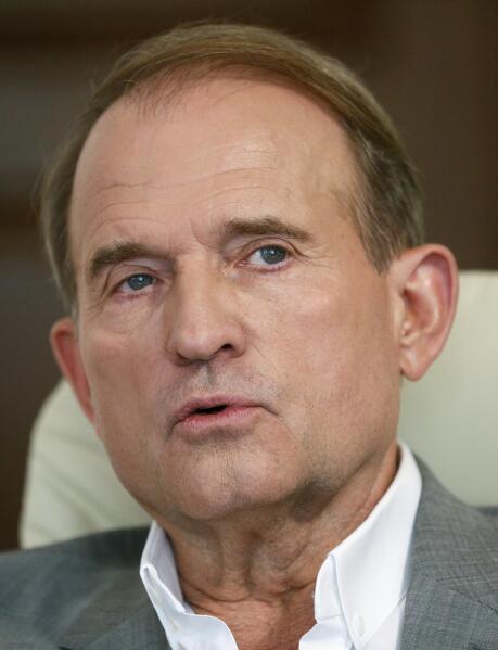 FILE-In this photo taken on Friday, July 12, 2019 a party led by one of Russian President Vladimir Putin's closest associates, tycoon Viktor Medvedchuk, talks during an interview with The Associated Press in Kyiv, Ukraine. Ukraine's Prosecutor General on Tuesday, May 11, 2021, has charged Medvedchuk with high treason, dealing a blow to Kremlin's lobby in Ukraine. (AP Photo/Efrem Lukatsky)