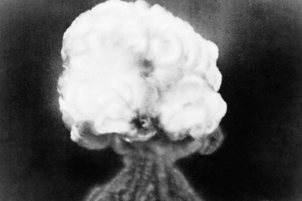 FILE - This July 16, 1945, file photo, shows the mushroom cloud of the first atomic explosion at Trinity Test Site near Alamagordo, N.M. New Mexico Attorney General Raúl Torrez and top prosecutors from several other states and the District of Columbia are uniting in support of efforts to compensate people sickened by exposure to radiation during nuclear weapons testing. (AP Photo/File)