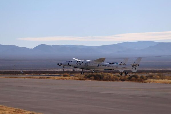 This photo provided by Virgin Galactic, Virgin Galactic's SpaceShipTwo Unity, attached to mothership, VMS Eve, takes off on Saturday, Dec. 12, 2020 at Spaceport America in southern New Mexico.   Saturday morning’s test flight marks the third space flight overall for Virgin Galactic as the company looks to begin commercial flights next year.  (Virgin Galactic via AP)