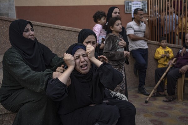 Palestinians mourn their relatives killed in the Israeli bombardment of the Gaza Strip, in the hospital in Khan Younis, Saturday, Nov. 11, 2023. ( AP Photo/Fatima Shbair)