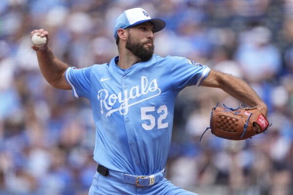 Kansas City Royals starting pitcher Michael Wacha throws during the first inning of a baseball game against the Detroit Tigers, Saturday, May 31, 2025, in Kansas City, Mo. (AP Photo/Charlie Riedel)
