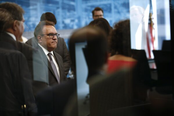 Environmental Protection Agency Administrator Andrew Wheeler speaks with reporters after a news conference to announce plans to revoke the Waters of the United States rule, an Obama-era regulation ...