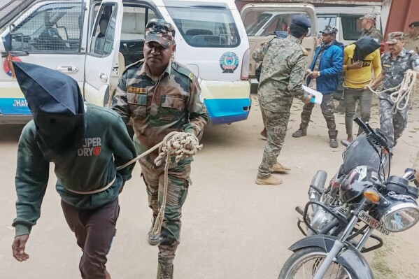 Three men arrested for the alleged gang rape of a Spanish tourist are brought by police to be produced before the Dumka District Court in Dumka, Jharkhand, India, Monday, March 4, 2024. (AP Photo/Rajesh Kumar)