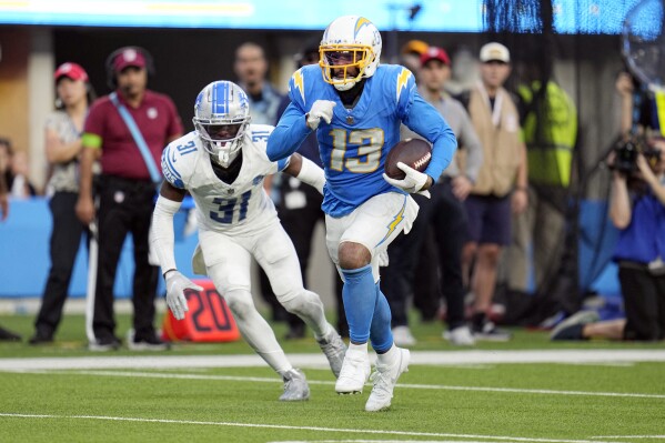 Los Angeles Chargers wide receiver Keenan Allen (13) runs for a touchdown during the second half an NFL football game against the Detroit Lions Sunday, Nov. 12, 2023, in Inglewood, Calif. (AP Photo/Gregory Bull)