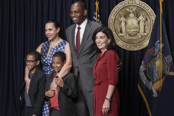 New York Gov. Kathy Hochul, right, stands with Democrat Antonio Delgado, second from right, his wife, Lacey Schwartz Delgado, and their twin 8-year-old boys Coltrane, left, and Maxwell, center, after he was sworn in as New York's lieutenant governor, becoming the state's first person of Latino heritage to serve in statewide office, Wednesday May 25, 2022, in New York. (AP Photo/Bebeto Matthews)