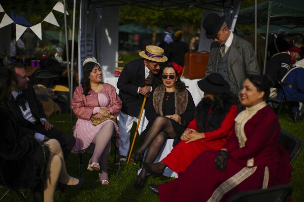 Participants gather for an Old Fashioned Fest at a park in Santiago, Chile, Saturday, April 5, 2025. (AP Photo/Esteban Felix)
