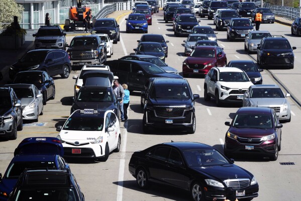 FILE - Heavy traffic is seen at O'Hare International Airport in Chicago, Monday, April 15, 2024. Relentlessly rising auto insurance rates are squeezing car owners and stoking inflation. Auto insurance rates rose 2.6% in March and are up 22% from a year ago. (Ǻ Photo/Nam Y. Huh, File)