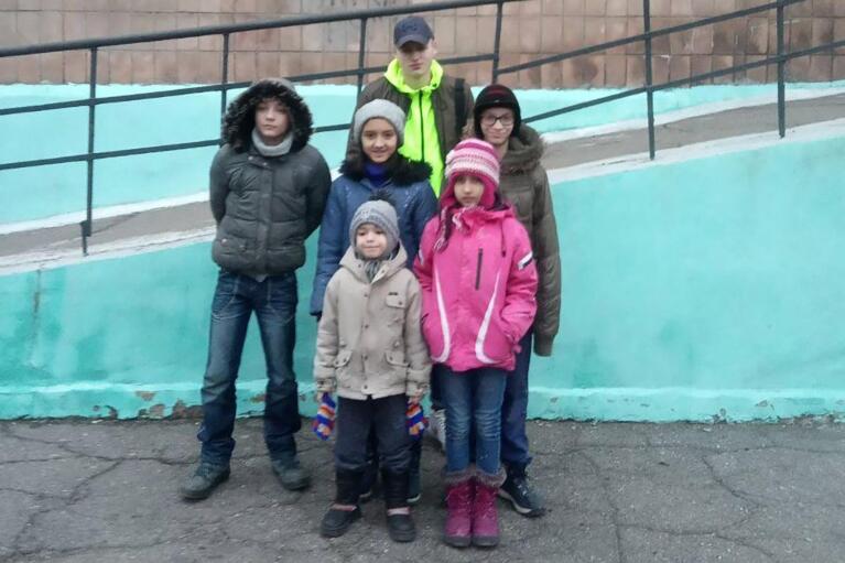 Olga Lopatkina’s adopted children pose for a photo in Mariupol, Ukraine in February 2022. (Lopatkin Family via AP)


