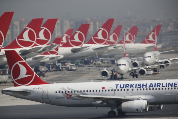 FILE - Turkish Airlines airplanes are parked at Ataturk International Airport, in Istanbul, Friday, April 5, 2019. Afghanistan’s Taliban government confirmed the resumption of Turkish Airlines flights to Kabul’s international airport, nearly three years after the carrier’s services were suspended following the collapse of the Western-backed government. (AP Photo/Lefteris Pitarakis, File)