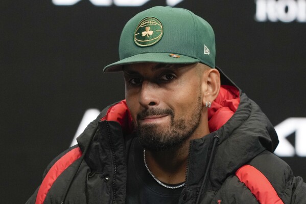 Australia's Nick Kyrgios answers questions at a press conference ahead of the Australian Open tennis championship in Melbourne, Australia, Friday, Jan. 10, 2025. (AP Photo/Ng Han Guan)