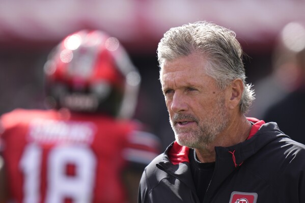 FILE - Utah head coach Kyle Whittingham looks on before an NCAA college football game against Oregon Saturday, Oct. 28, 2023, in Salt Lake City. Family ties run deep within the Utah football program. “Now we’re recruiting (kids) of players I coached,” Utah coach Kyle Whittingham said. “That really shows how old I’m getting. But I view that as a positive and I hope it continues.” (AP Photo/Rick Bowmer, File)