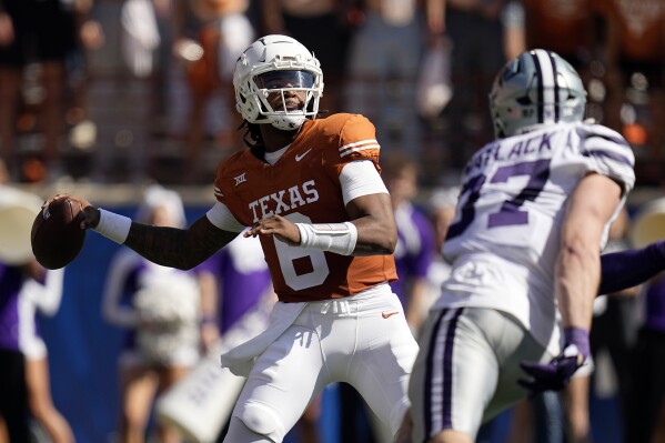 Texas quarterback Maalik Murphy (6) throws under pressure during the second half of an NCAA college football game against Kansas State in Austin, Texas, Saturday, Nov. 4, 2023. (AP Photo/Eric Gay)