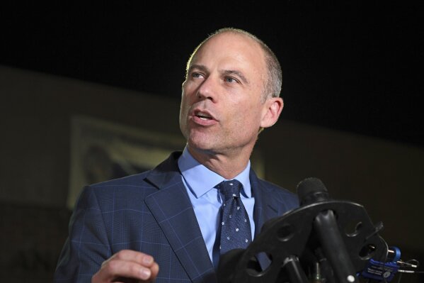 
              FILE - In this Nov. 14, 2018, file photo, Michael Avenatti speaks to the media outside the Los Angeles Police Department Pacific Division after posting bail for a felony domestic violence charge. U.S. prosecutors announced Monday, March 25, 2019 they have charged Avenatti with extortion and bank and wire fraud. A spokesman for the U.S. attorney in Los Angeles said Avenatti was arrested Monday in New York. (AP Photo/Michael Owen Baker, File)
            