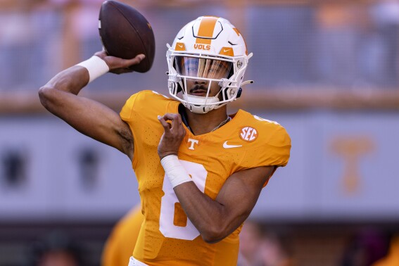 Tennessee quarterback Nico Iamaleava (8) throws to a receiver during warmups before an NCAA college football game against Georgia, Saturday, Nov. 18, 2023, in Knoxville, Tenn. (AP Photo/Wade Payne)