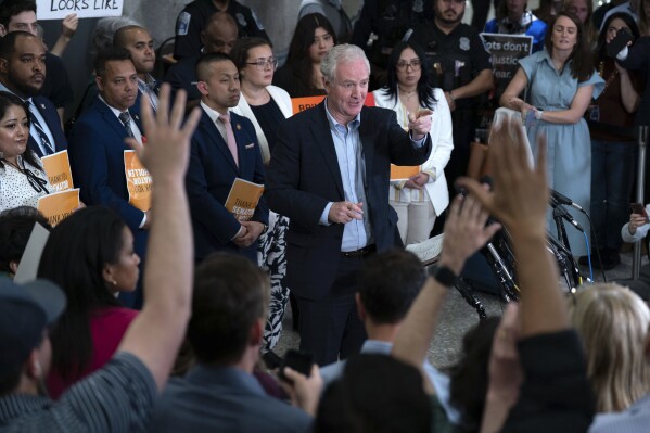 Sen. Chris Van Hollen, D-Md., speaks during a news conference upon his arrival from meeting with Kilmar Abrego Garcia in El Salvador, at Washington Dulles International Airport, in Chantilly, Va., Friday, April 18, 2025. (AP Photo/Jose Luis Magana)