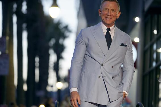 FILE - Daniel Craig appears during a ceremony honoring him with a star on the Hollywood Walk of Fame, Oct. 6, 2021, in Los Angeles. Craig has been made an Ordinary Companion of St Michael and St George (CMG) on the Diplomatic Service and Overseas List for services to film and theatre in the 2021 New Year honours list (AP Photo/Chris Pizzello, file)