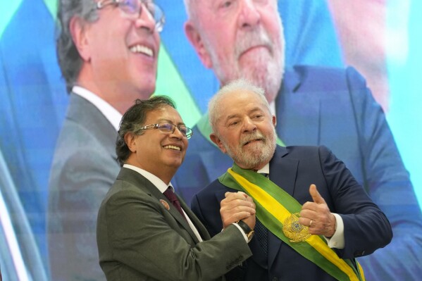 FILE - President Luiz Inacio Lula da Silva, right, poses for a picture with Colombia's President Gustavo Petro, at the Planalto Palace, in Brasilia, Brazil, Jan. 1, 2023. Lula met with Petro on Saturday, July 8, 2023, to build momentum for an upcoming summit on the Amazon rainforest and enhance efforts for its protection.(AP Photo/Eraldo Peres, File)