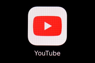 FILE - The YouTube app is displayed on an iPad in Baltimore. YouTube has blocked access to videos of a protest song in Hong Kong, days after court approved an injunction banning the song in the city. (AP Photo/Patrick Semansky, File)