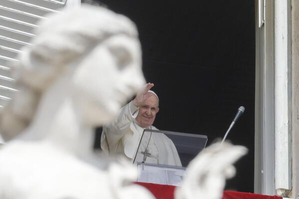 Pope Francis delivers his blessing as he recites the Regina Caeli noon prayer from the window of his studio overlooking St.Peter's Square, at the Vatican, Sunday, April 18, 2021. Pope Francis said he is happy to be back greeting the faithful in St. Peter’s Square faithful for his traditional Sunday noon blessing after weeks of lockdown measures. (AP Photo/Andrew Medichini)