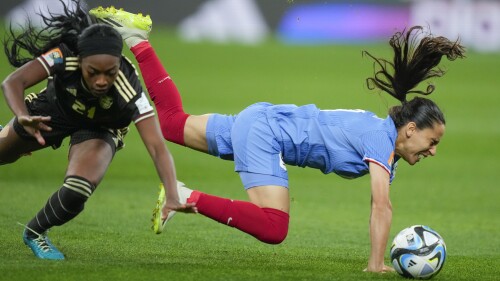 France's Amel Majri, right, vies for the ball with Jamaica's Cheyna Matthews during the Women's World Cup Group F soccer match between France and Jamaica at the Sydney Football Stadium in Sydney, Australia, Sunday, July 23, 2023. (AP Photo/Rick Rycroft)