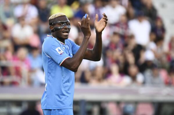Napoli's Victor Osimhen reacts during the Italian Serie A soccer match between Bologna and Napoli, at the Renato Dall'Ara stadium in Bologna, Italy, Sunday, Sept. 24, 2023. (Massimo Paolone/LaPresse via AP)