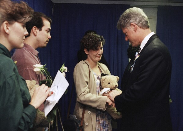 Aren Almon greets President Bill Clinton after a prayer service for the victims of the deadly truck bomb attack in Oklahoma City on April 23, 1995. (AP Photo/Pat Sullivan, File)