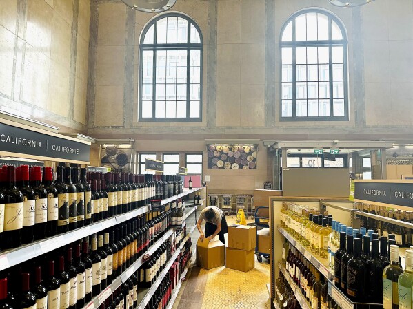 An employee boxes up American products at an LCBO outlet in Toronto on Tuesday, March 4, 2025. (Chris Young/The Canadian Press via AP)