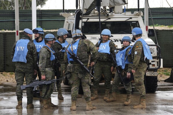 Spanish U.N. peacekeepers prepare for patrol in Abbassiyeh, a Lebanese border village with Israel, on Wednesday, Jan. 10, 2024. (AP Photo/Hussein Malla)