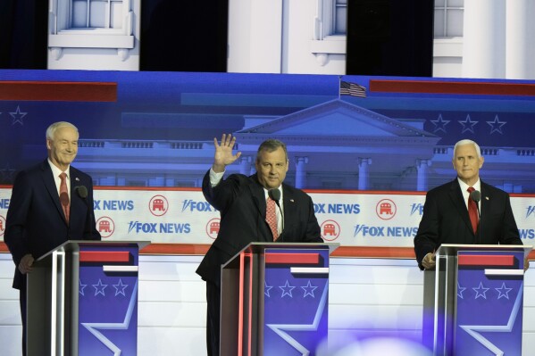 Former Arkansas Gov. Asa Hutchinson, former New Jersey Gov. Chris Christie and former Vice President Mike Pence are introduced at a Republican presidential primary debate hosted by FOX News Channel Wednesday, Aug. 23, 2023, in Milwaukee. (AP Photo/Morry Gash)