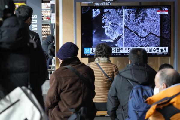 A TV screen shows images showing a space view of the South Korean capital and Incheon, left, during a news program at the Seoul Railway Station in Seoul, South Korea, Monday, Dec. 19, 2022. North Korea said Monday it fired a test satellite in an important final-stage test for the development of its first spy satellite, a key military capability coveted by its leader Kim Jong Un along with other high-tech weapons systems. (AP Photo/Ahn Young-joon)