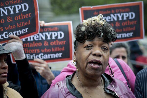 
              FILE - In this Thursday, May 9, 2019, file photo, Gwen Carr, left, mother of Eric Garner, an unarmed black man who died as he was being subdued in a chokehold by police Officer Daniel Pantaleo nearly five years earlier, speaks during a news conference after leaving court in New York. A long-delayed disciplinary trial is set to begin, Monday, May 13, 2019, for the New York City police officer accused of using a banned chokehold in Garner's death in July 2014. (AP Photo/Bebeto Matthews, File)
            