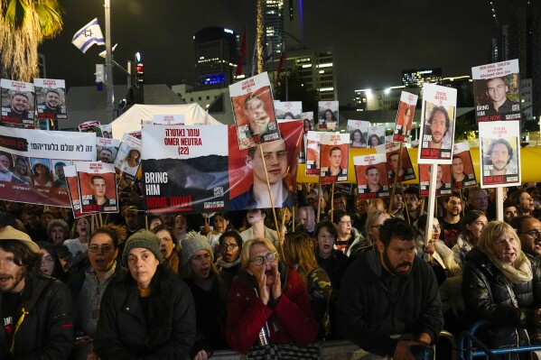 People attend a demonstration demanding the release of the hostages taken by Hamas militants into the Gaza Strip during the Oct. 7th attack, in Tel Aviv, Israel, Saturday, Jan. 27, 2024. Netanyahu is under mounting pressure from families of the hostages and the wider public to reach a deal with Hamas to bring the captives home. Many Israelis fear time is running out. (AP Photo/Ariel Schalit)